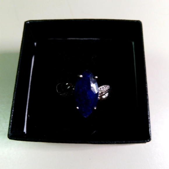 14k white gold over solid sterling silver diamonds and 2.5 CTW Sapphire. Natural